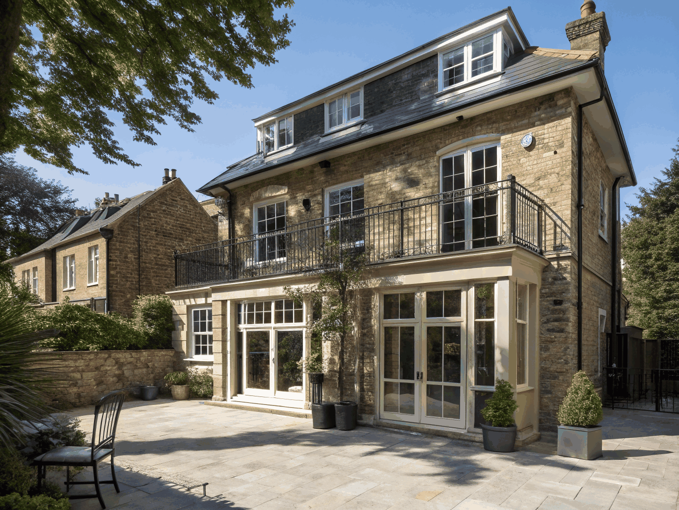 Twilight exterior of luxury British residential extension built by Harpenden Construction